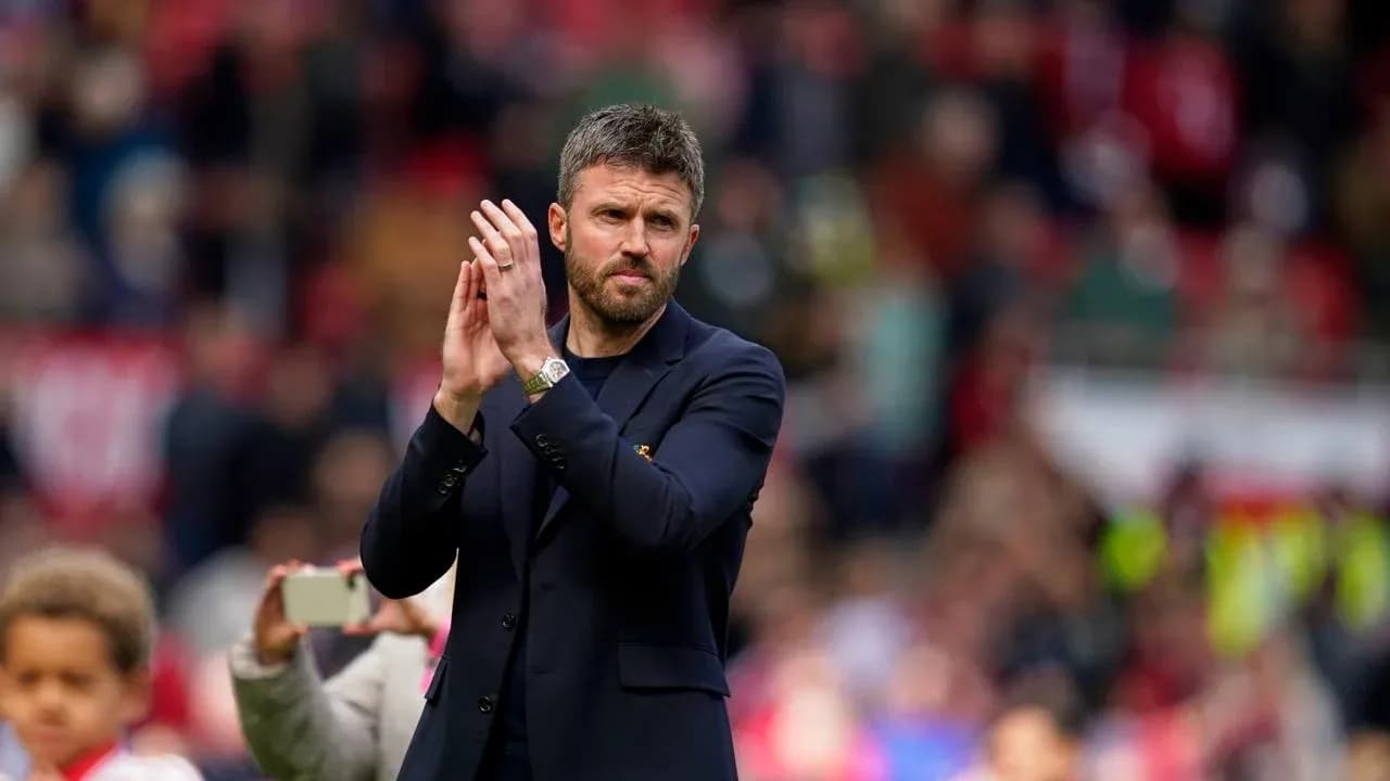 Coach applauding fans during post-match ceremony