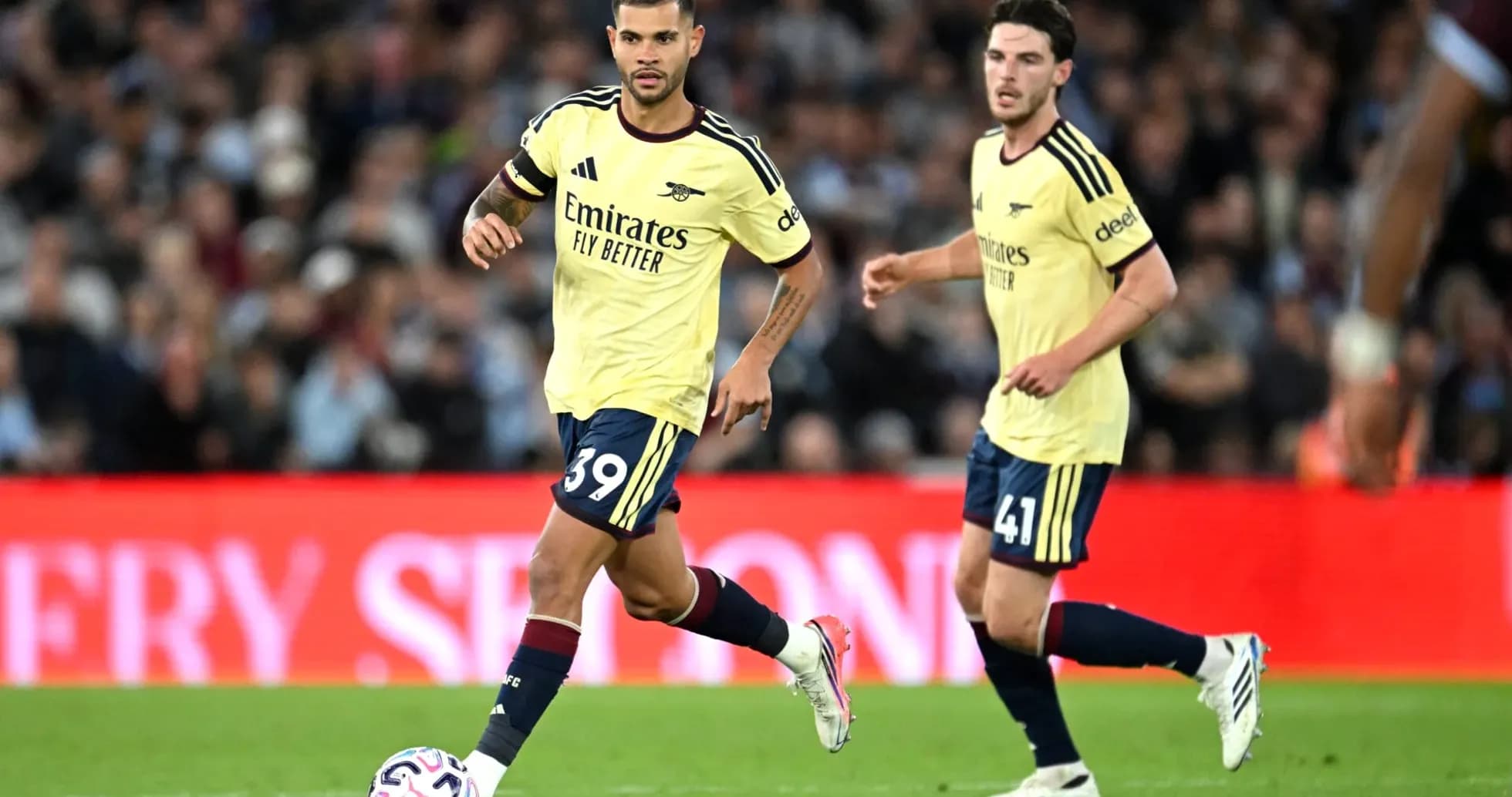 Arsenal players running during a match