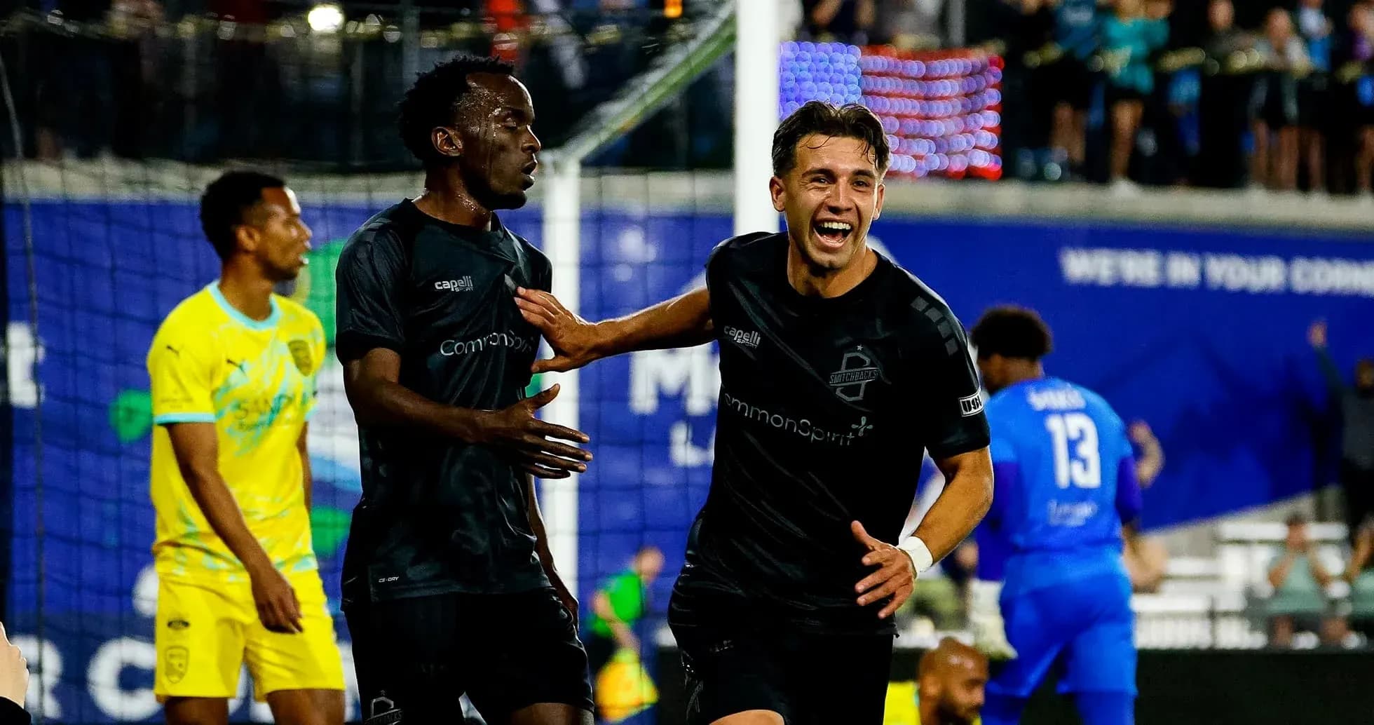 Players celebrating during FC Tulsa match
