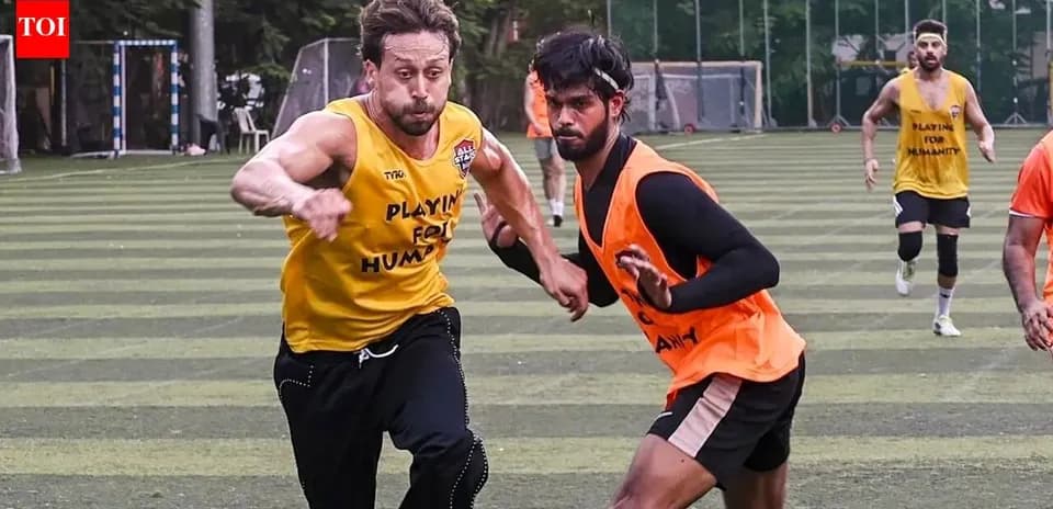 Two players sprinting during a football training session