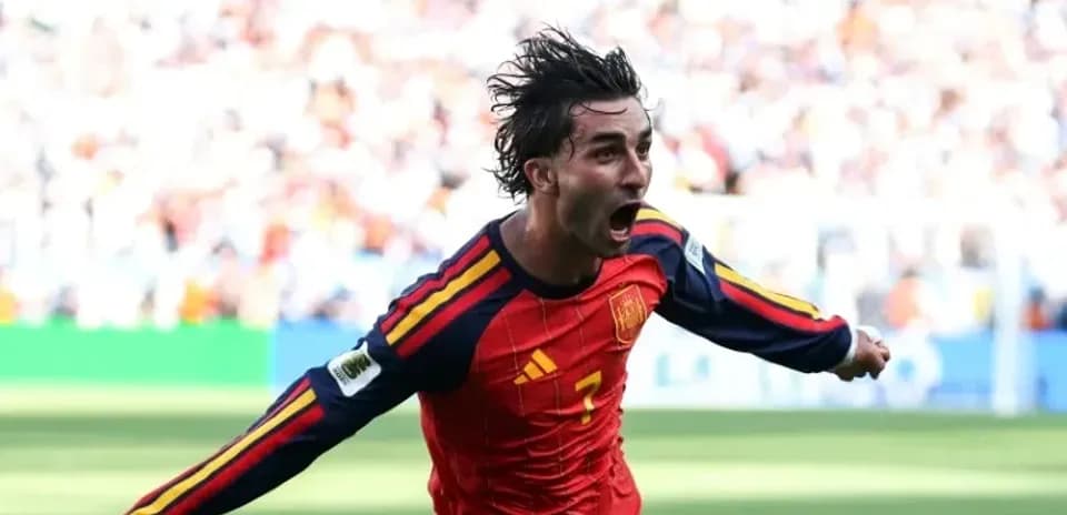 Player celebrating after scoring a goal for Spain