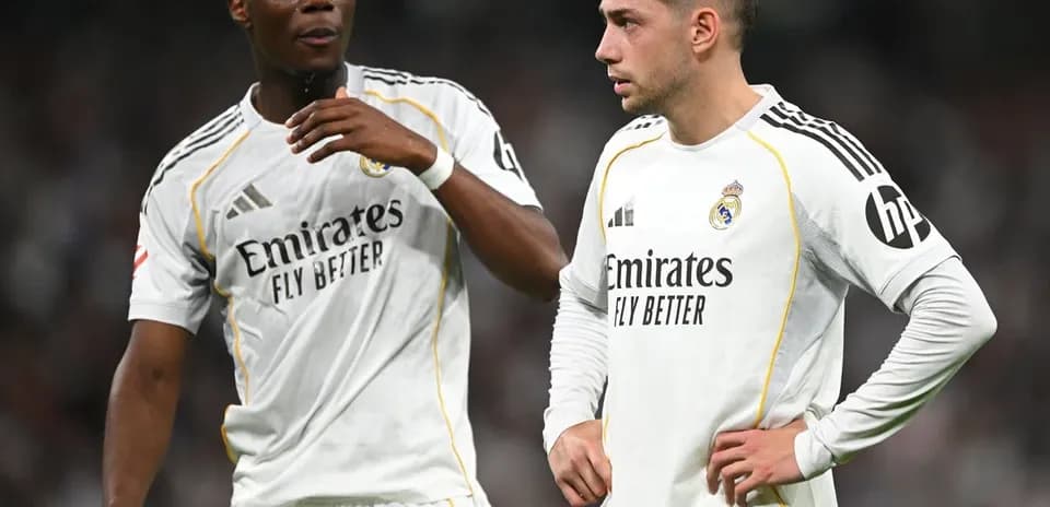 Two Real Madrid players discussing on the field