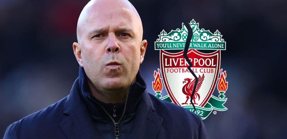 Coach in front of Liverpool FC logo