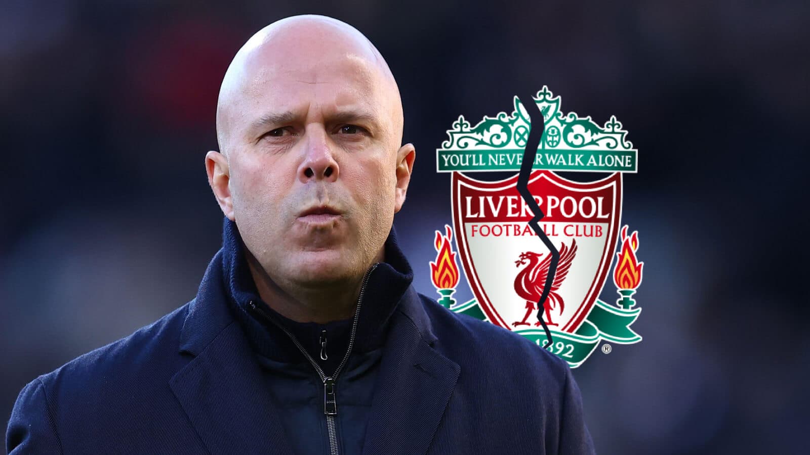 Coach in front of Liverpool FC logo
