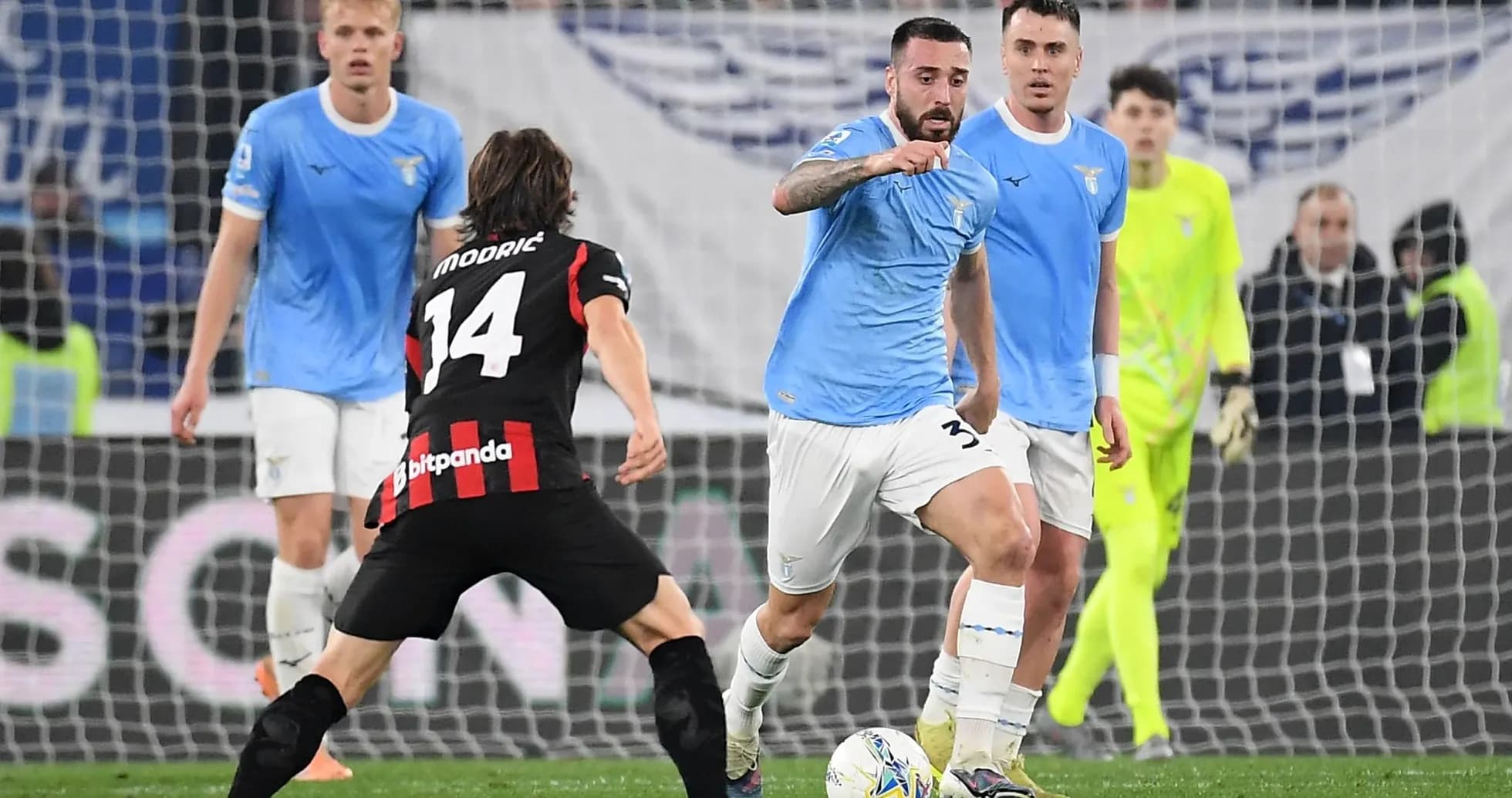 Lazio player dribbling against AC Milan