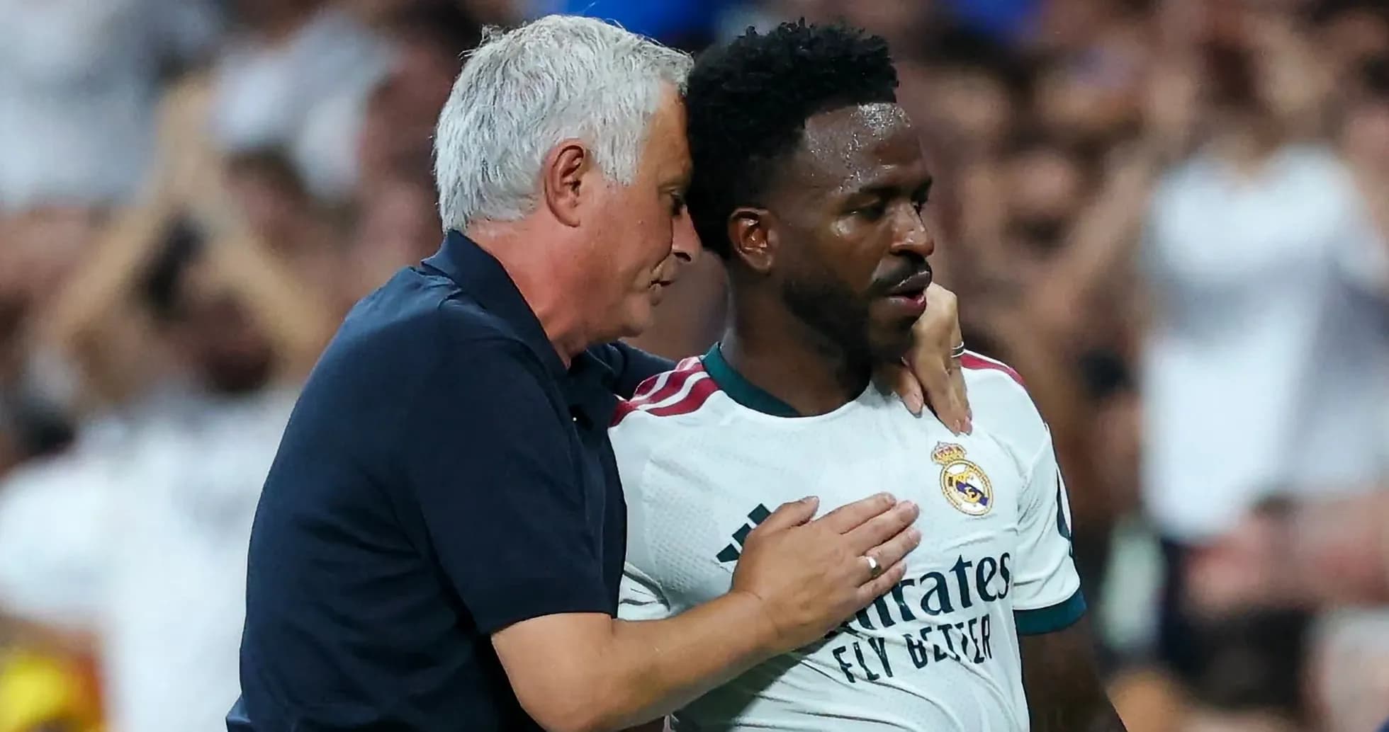 Coach discussing with player during match