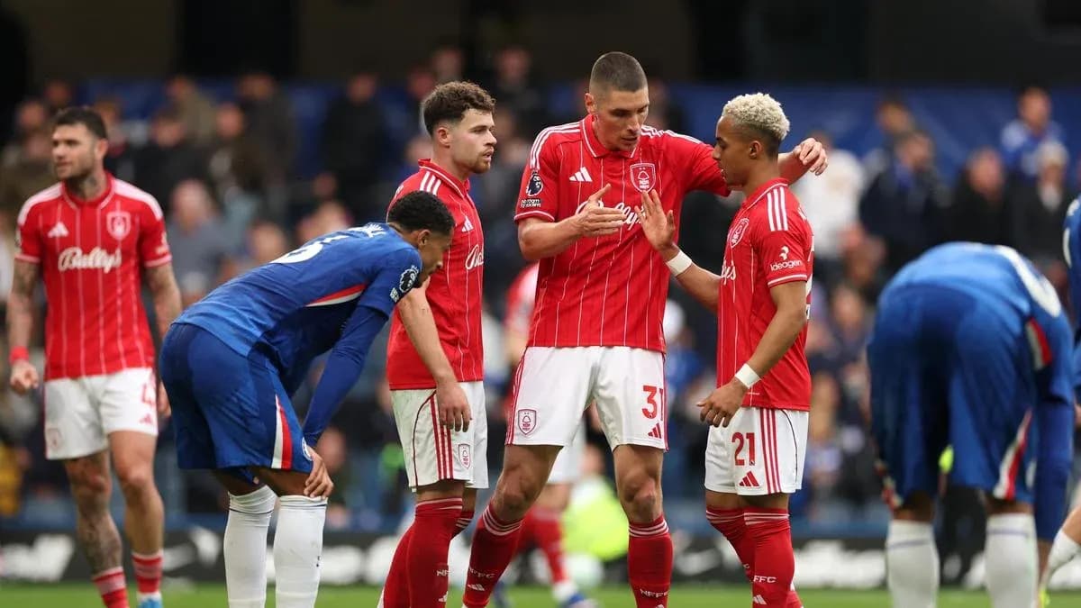 Players discussing strategy during a football match