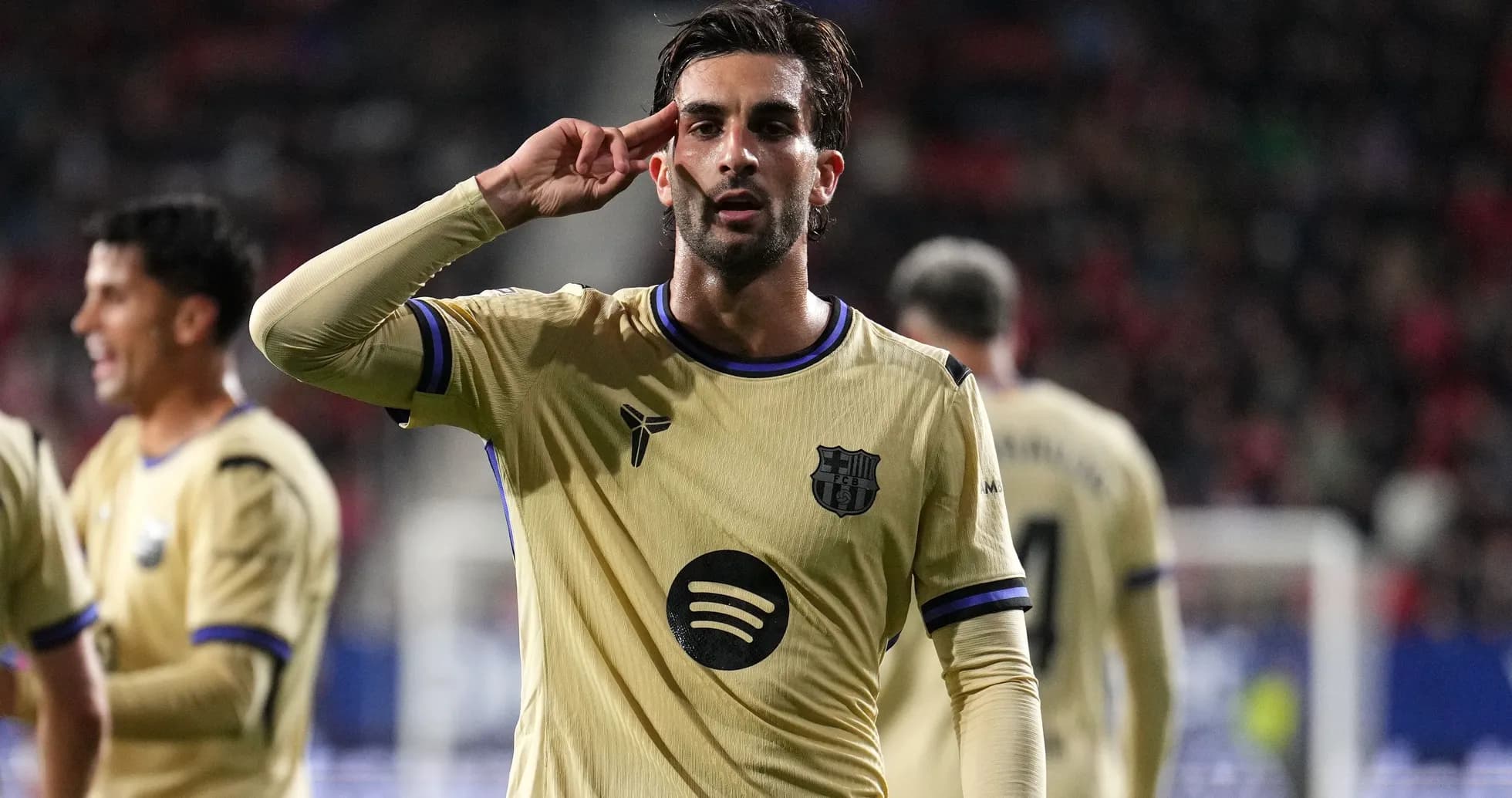Player celebrating with a salute after scoring