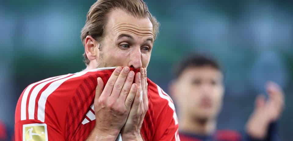 Player covering mouth with jersey during match