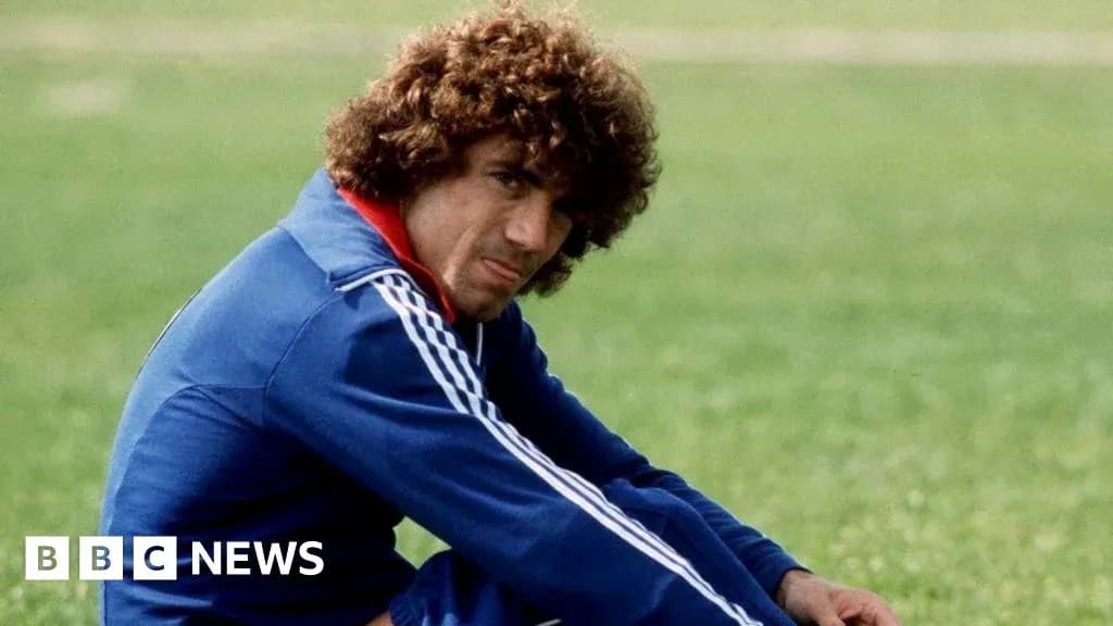 Player sitting on grass field in training gear