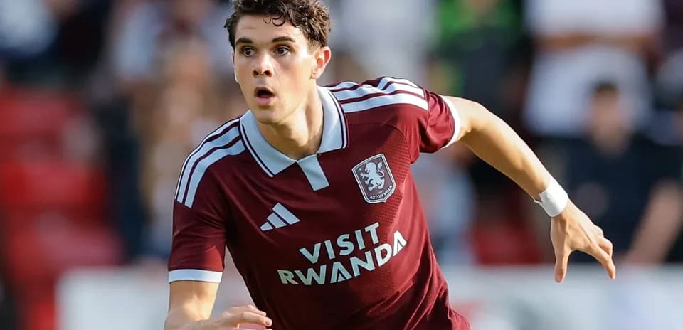 Player sprinting in Aston Villa kit during match