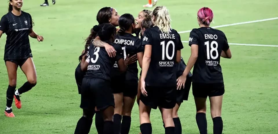 Angel City players celebrating a goal