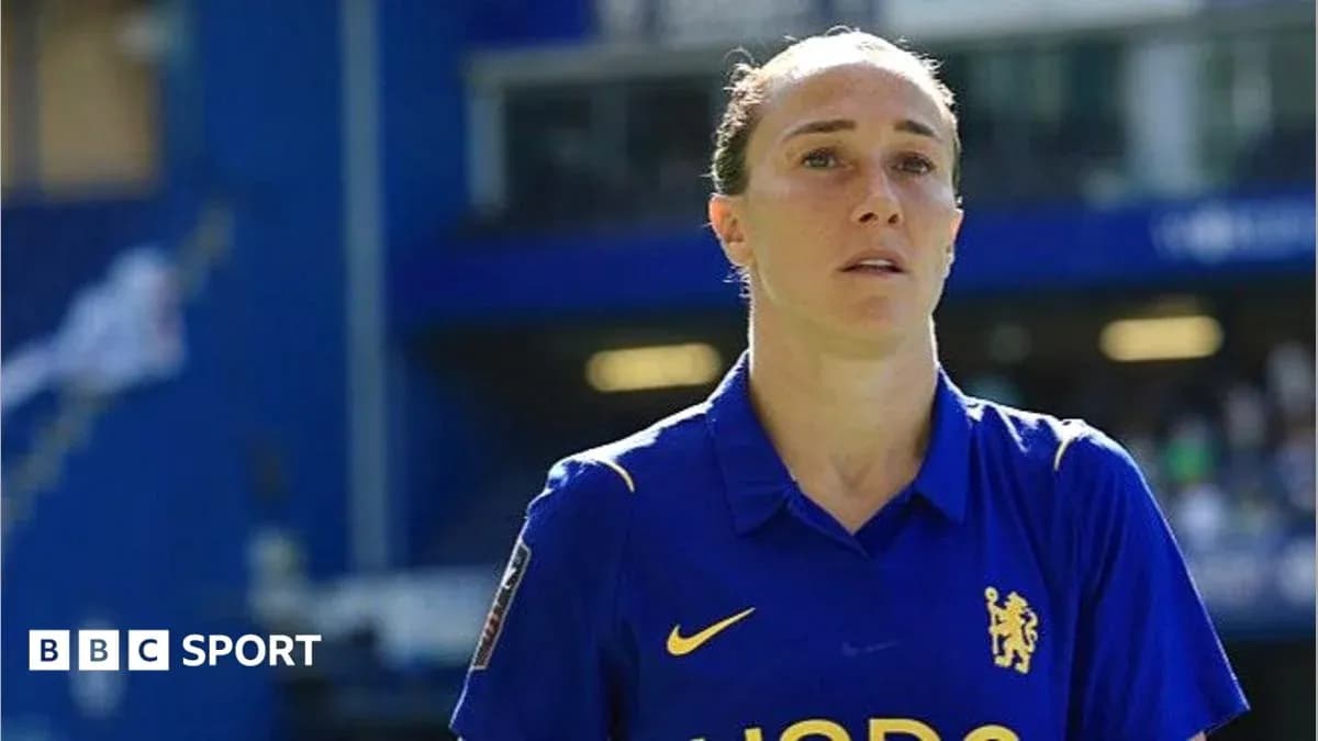 Player in blue jersey walking on the pitch