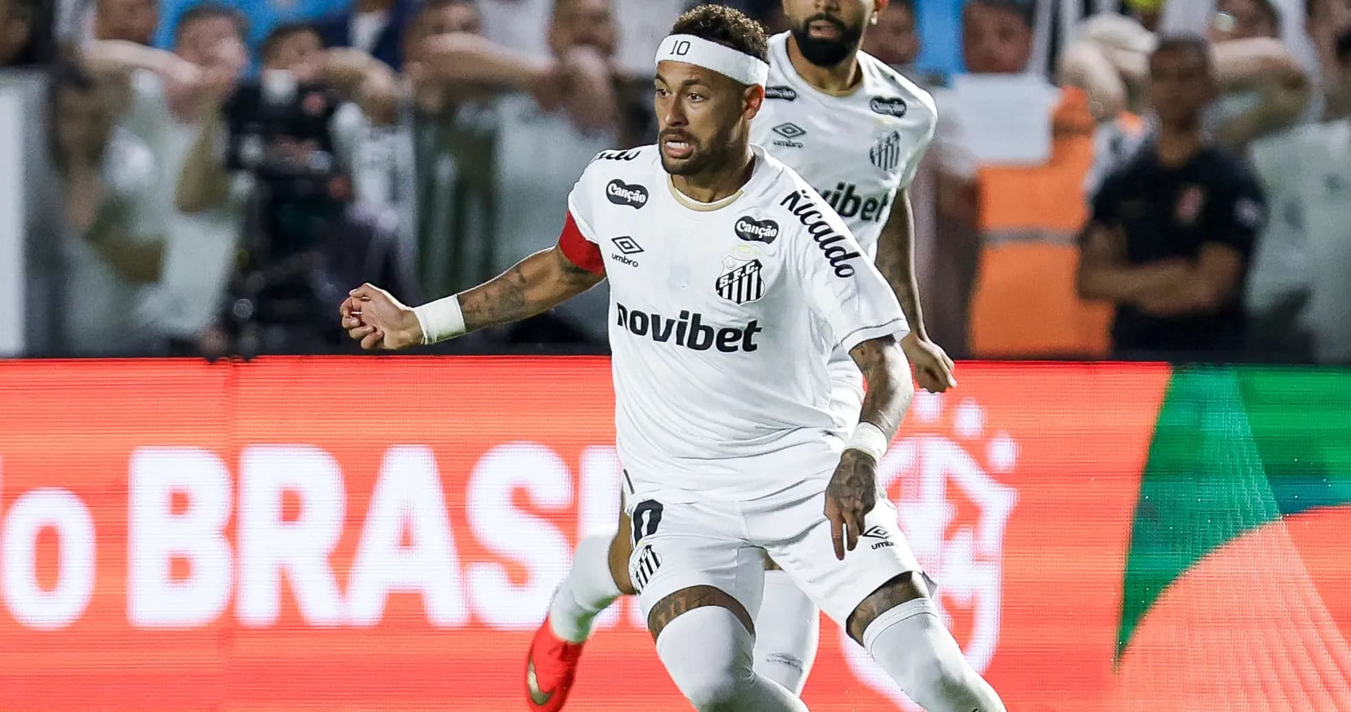 Neymar celebrating after scoring a goal for Santos