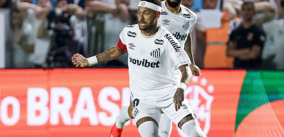 Neymar celebrating after scoring a goal for Santos