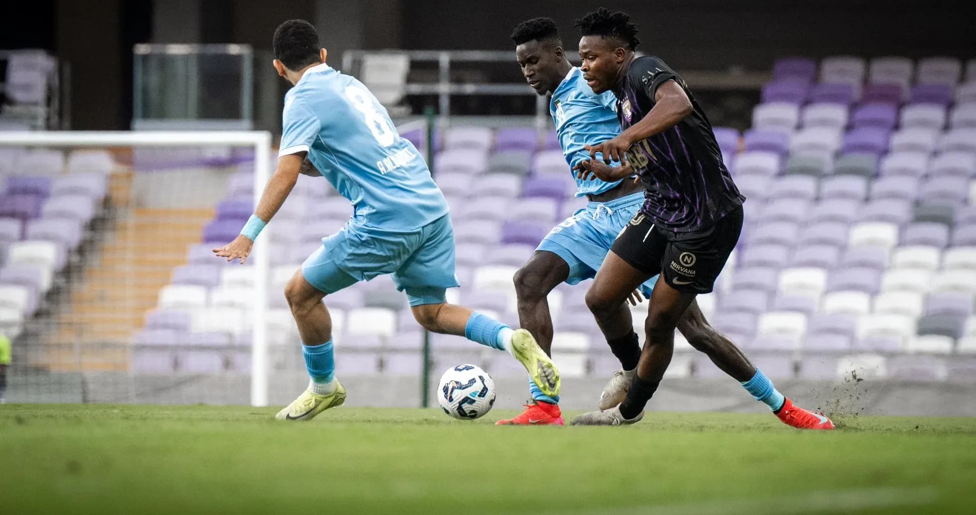 Two players competing for the ball in football match