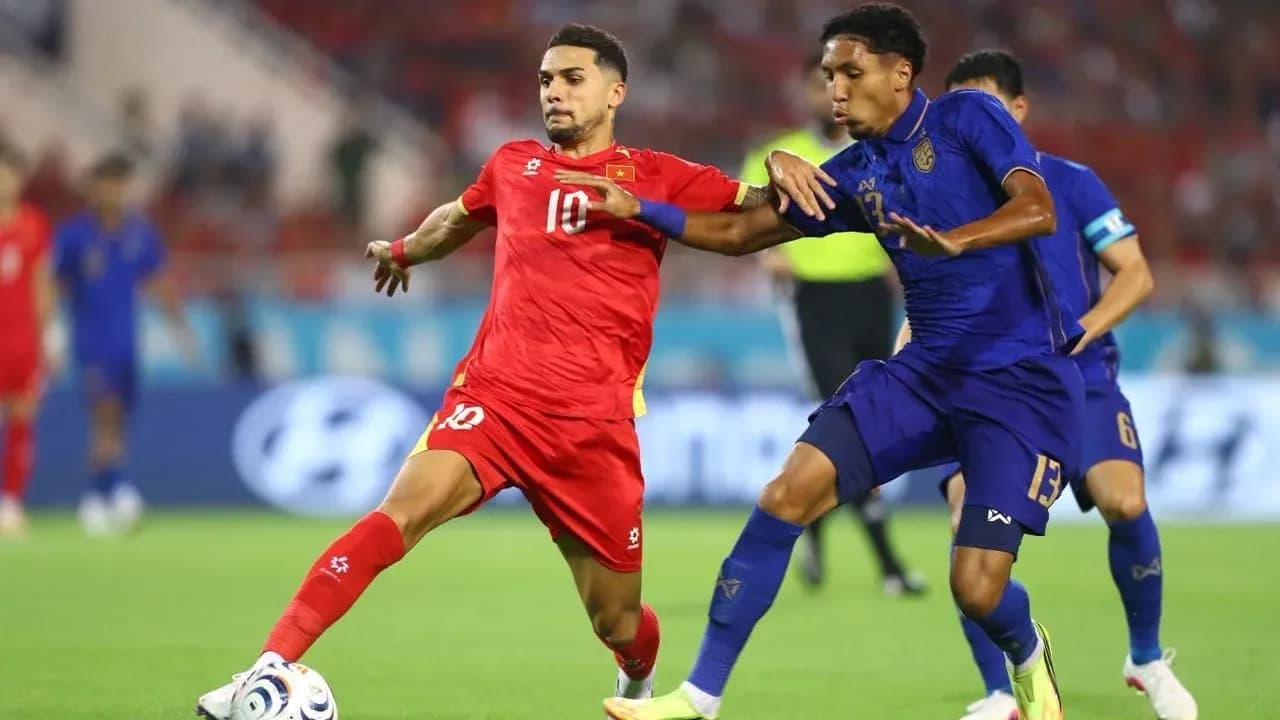 Two players competing for the ball during match