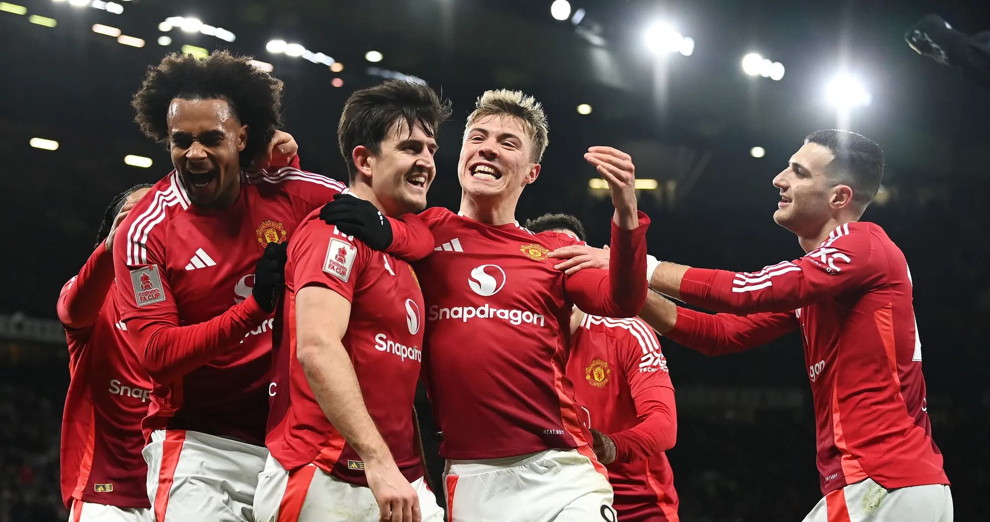 Manchester United players celebrating a goal together