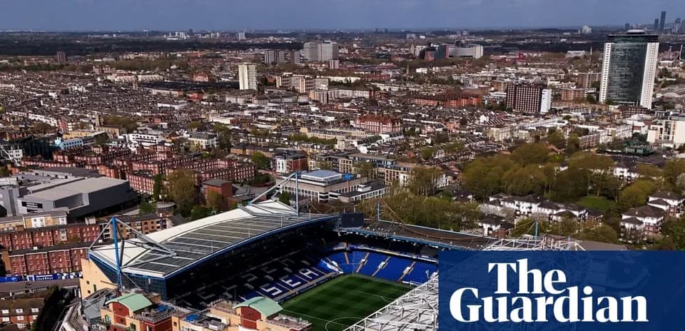 Aerial view of a football stadium and cityscape