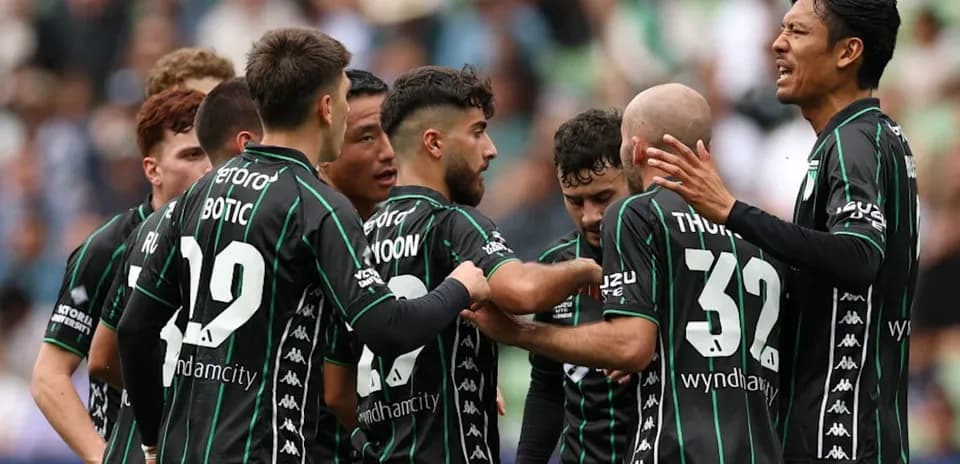 Players celebrating together after scoring a goal