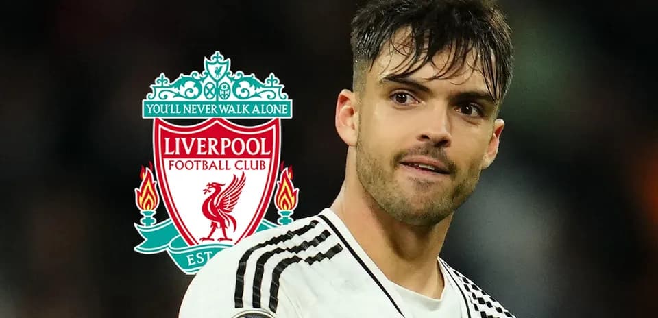 Player posing with Liverpool FC logo background