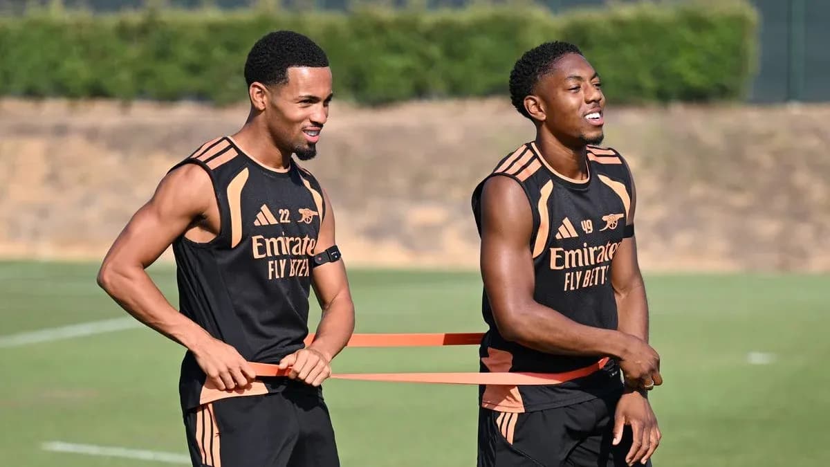 Two players training with resistance bands on field