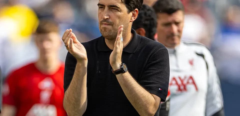 Coach applauding on the sideline during match