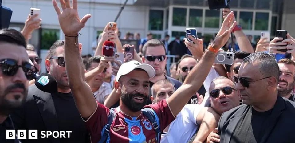 Football player greeting fans during arrival event