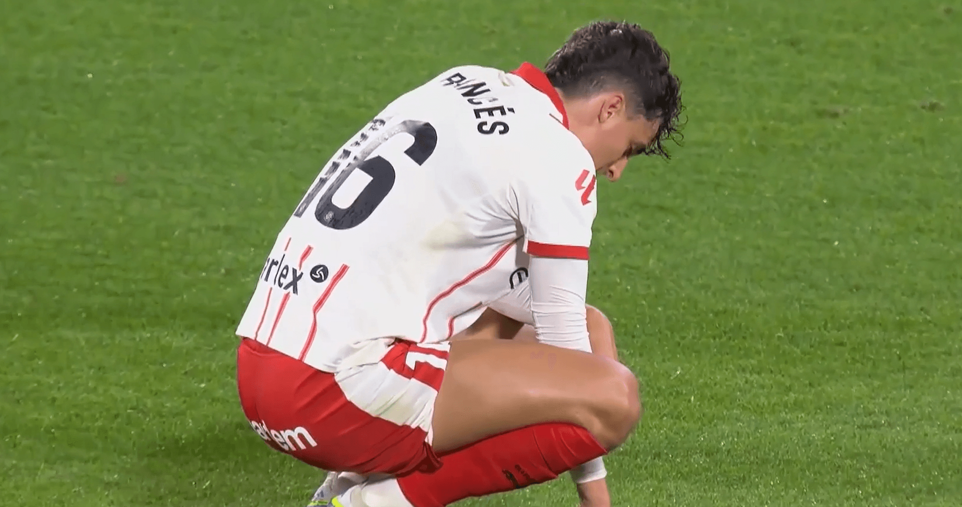 Girona player crouching on the pitch