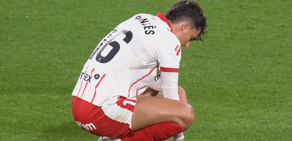 Girona player crouching on the pitch