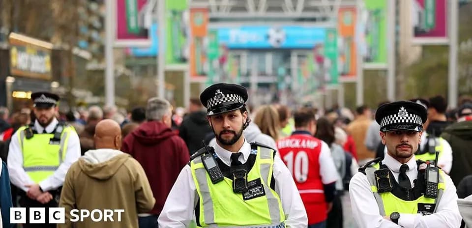 Police officers monitoring crowd outside Wembley Stadium