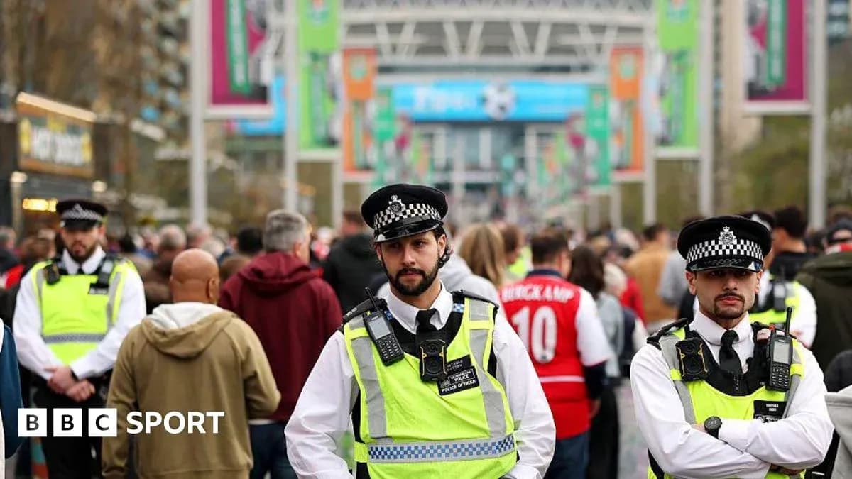 Police officers monitoring crowd outside Wembley Stadium