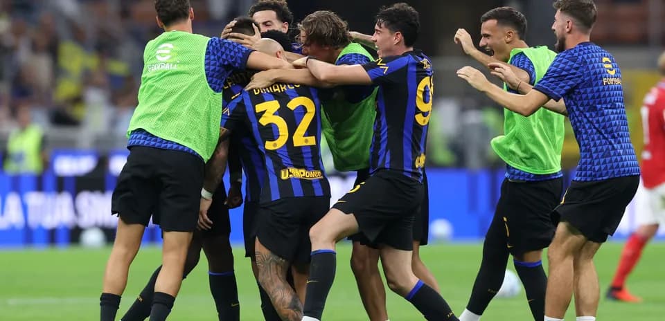 Players celebrating a goal during a match