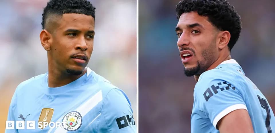 Two Manchester City players in training attire
