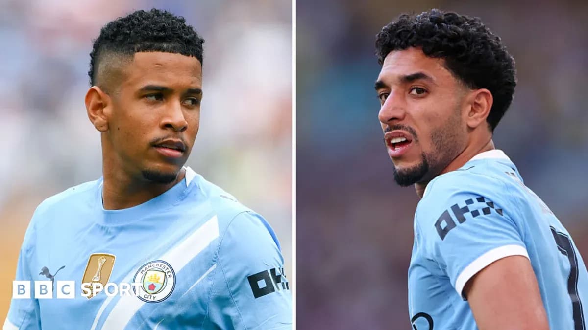 Two Manchester City players in training attire
