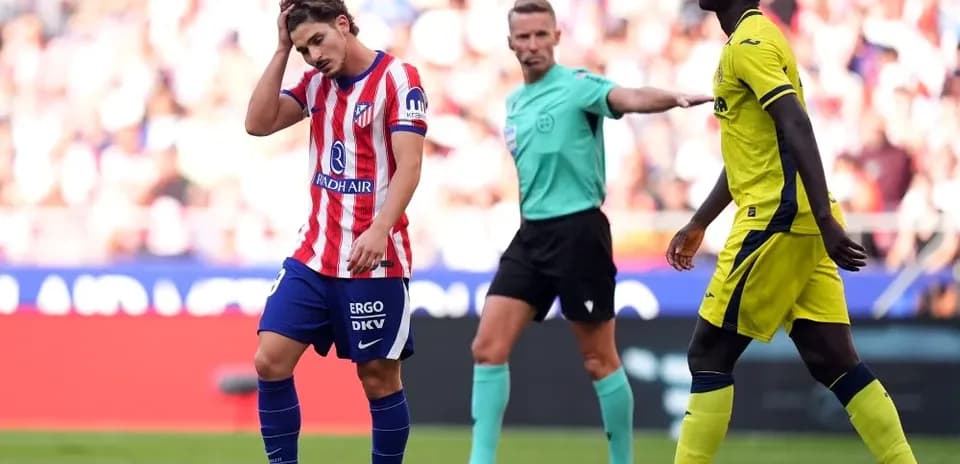 Player from Atlético Madrid shows frustration during match