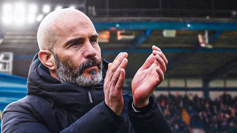 Coach applauding during a match at stadium