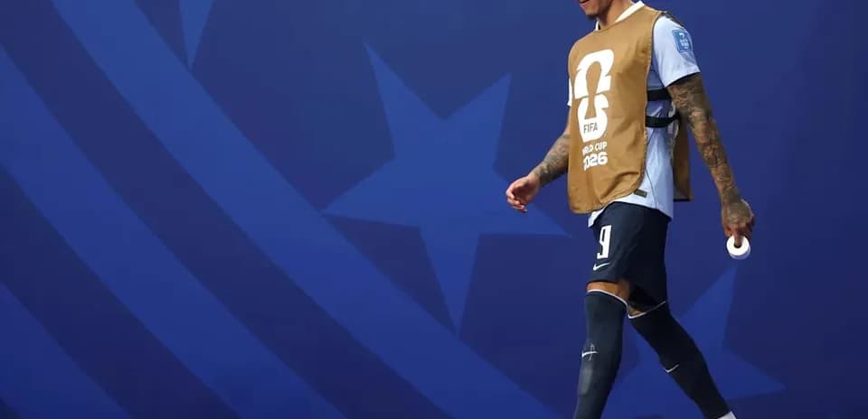 Player walking on field in FIFA World Cup attire