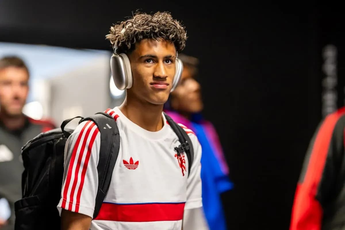 Player entering venue wearing headphones and backpack