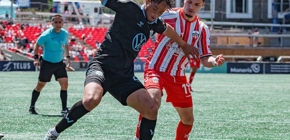 Player challenging for the ball during match