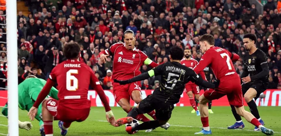 Liverpool players in action against Paris Saint Germain