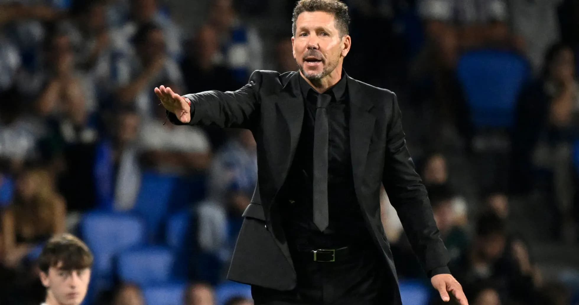 Coach directing players during a match