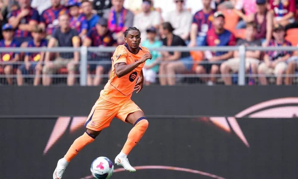 Player in orange kit sprinting on the field
