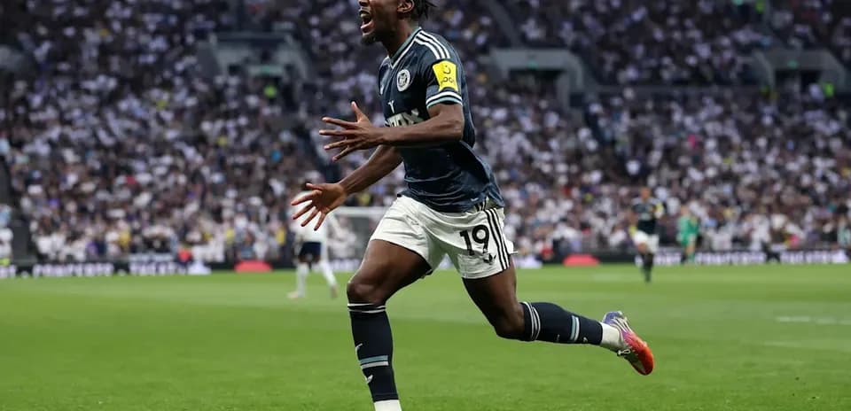 Player celebrating after scoring a goal on pitch