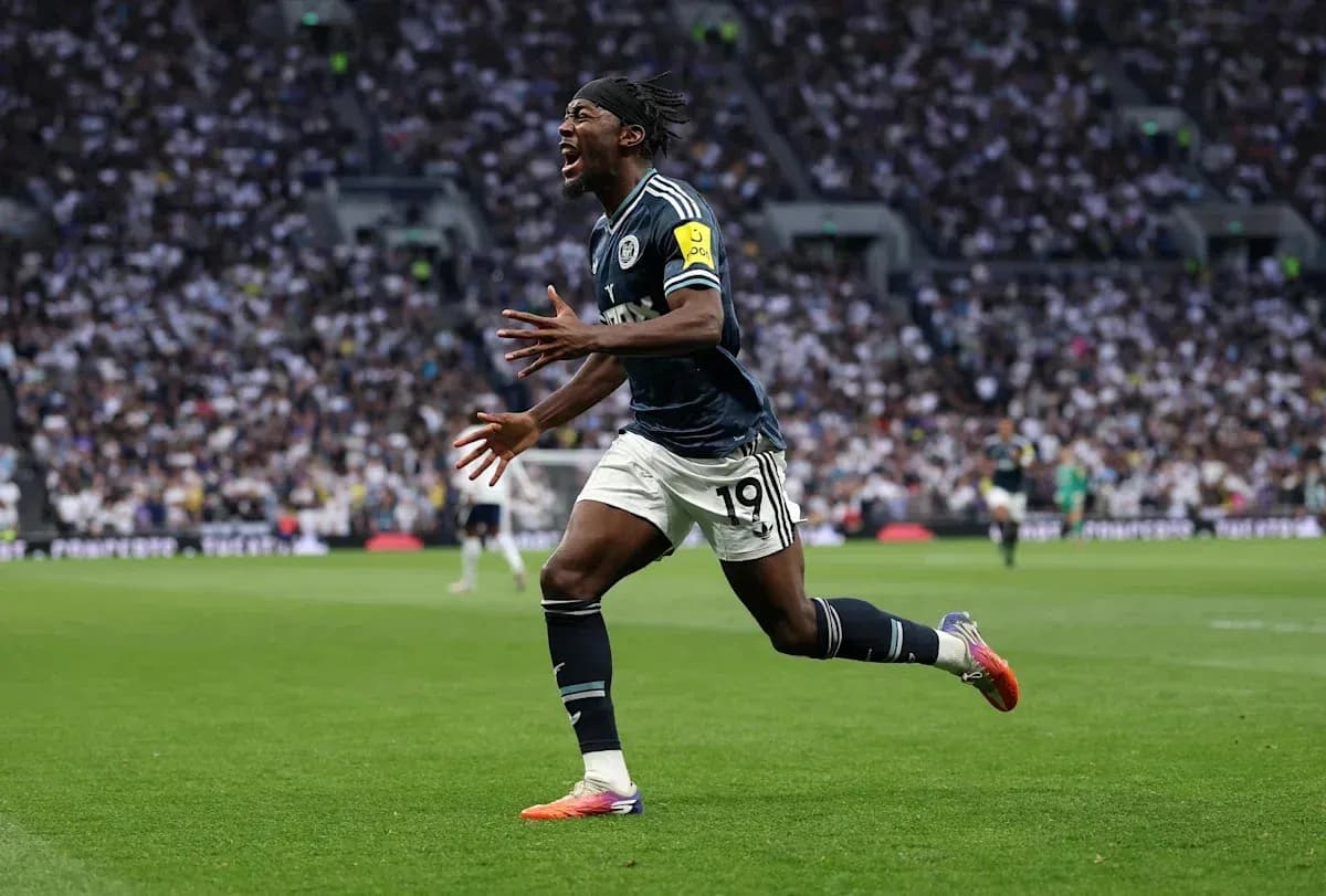 Player celebrating after scoring a goal on pitch