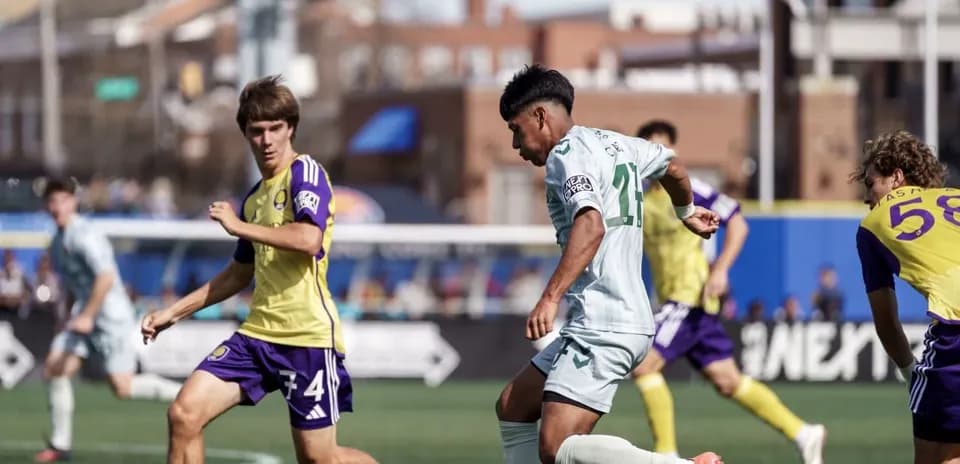 Orlando City II player dribbling against Carolina Core