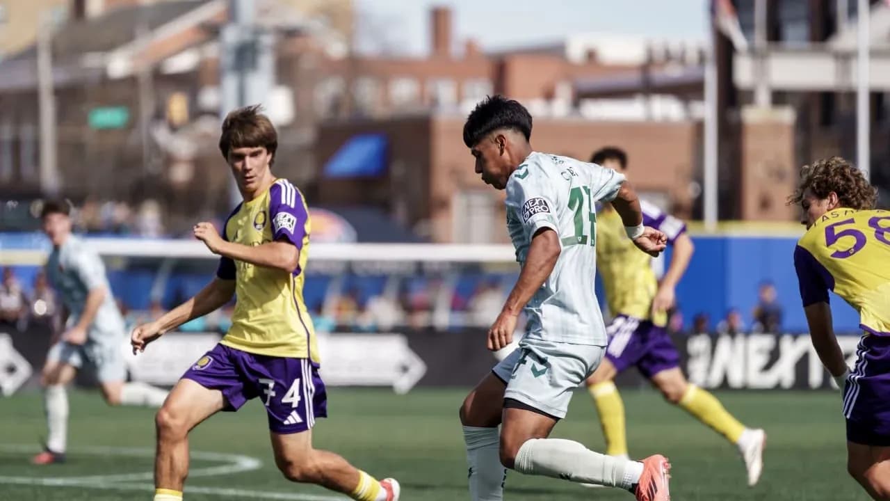 Orlando City II player dribbling against Carolina Core