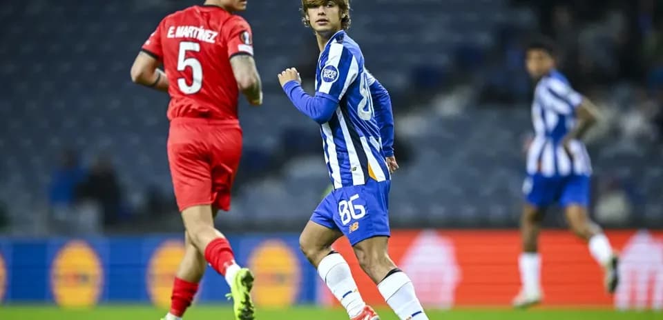 Player in blue jersey running on the pitch
