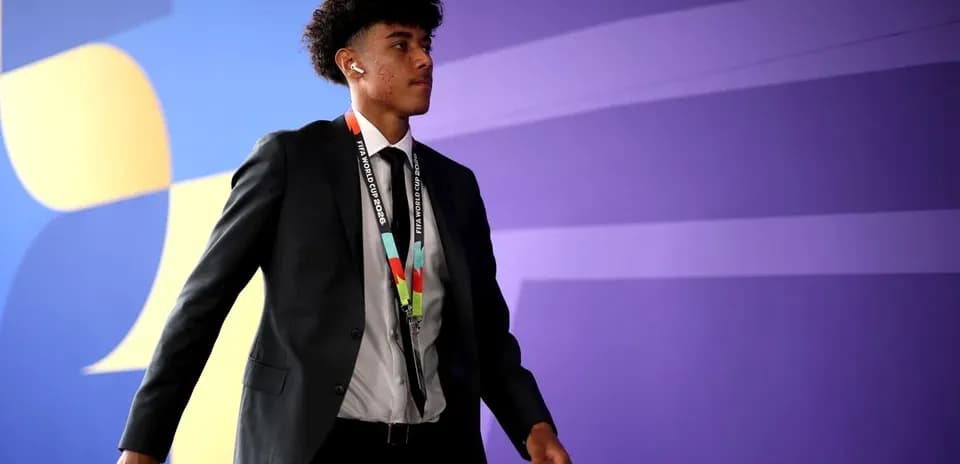 Player arriving at venue wearing formal attire
