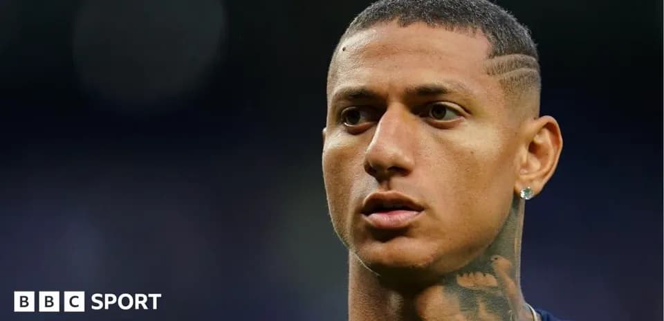 Player with short hair and earring in stadium